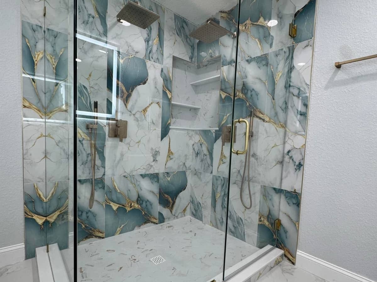 Walk-in shower renovation with decorative tile designs