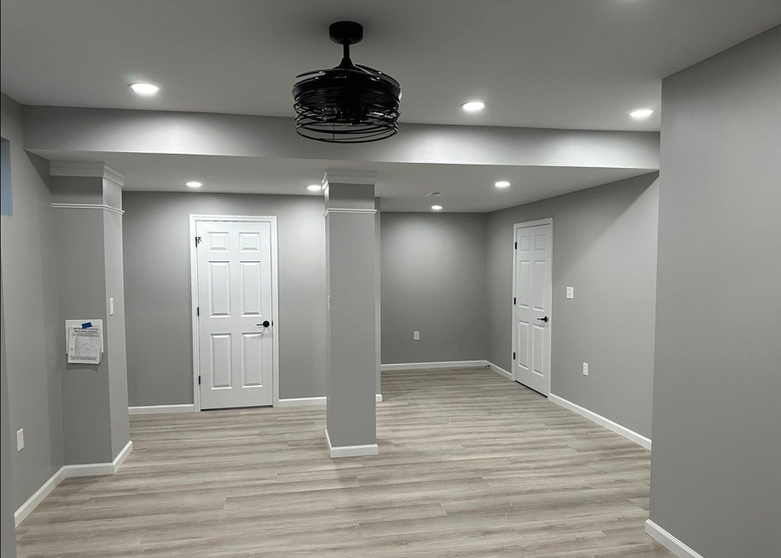 Freshly painted basement walls and white trim
