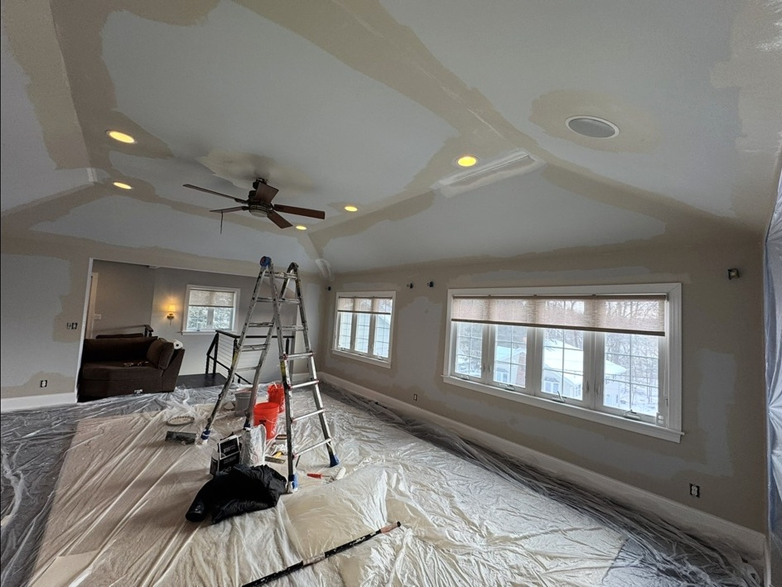 Repaired drywall patched and primed before painting