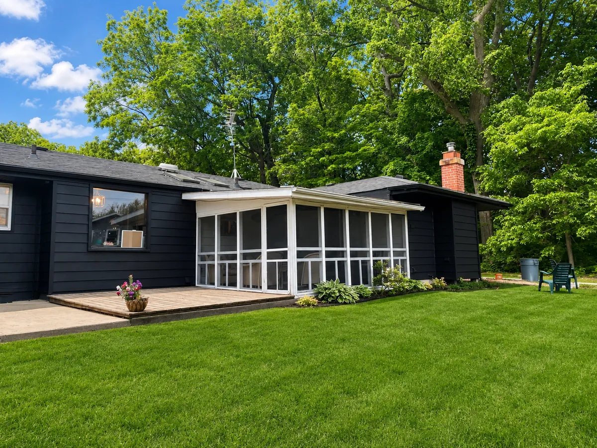 Black-sided home exterior repaint with screened porch
