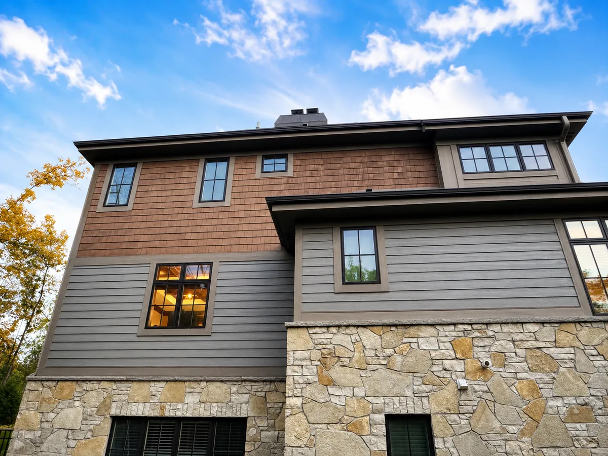 Brown modern multi-level home with stone exterior