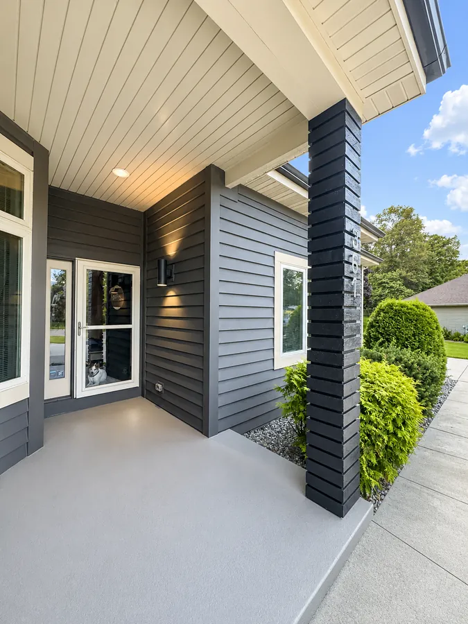 Modern two-tone charcoal siding home exterior painting