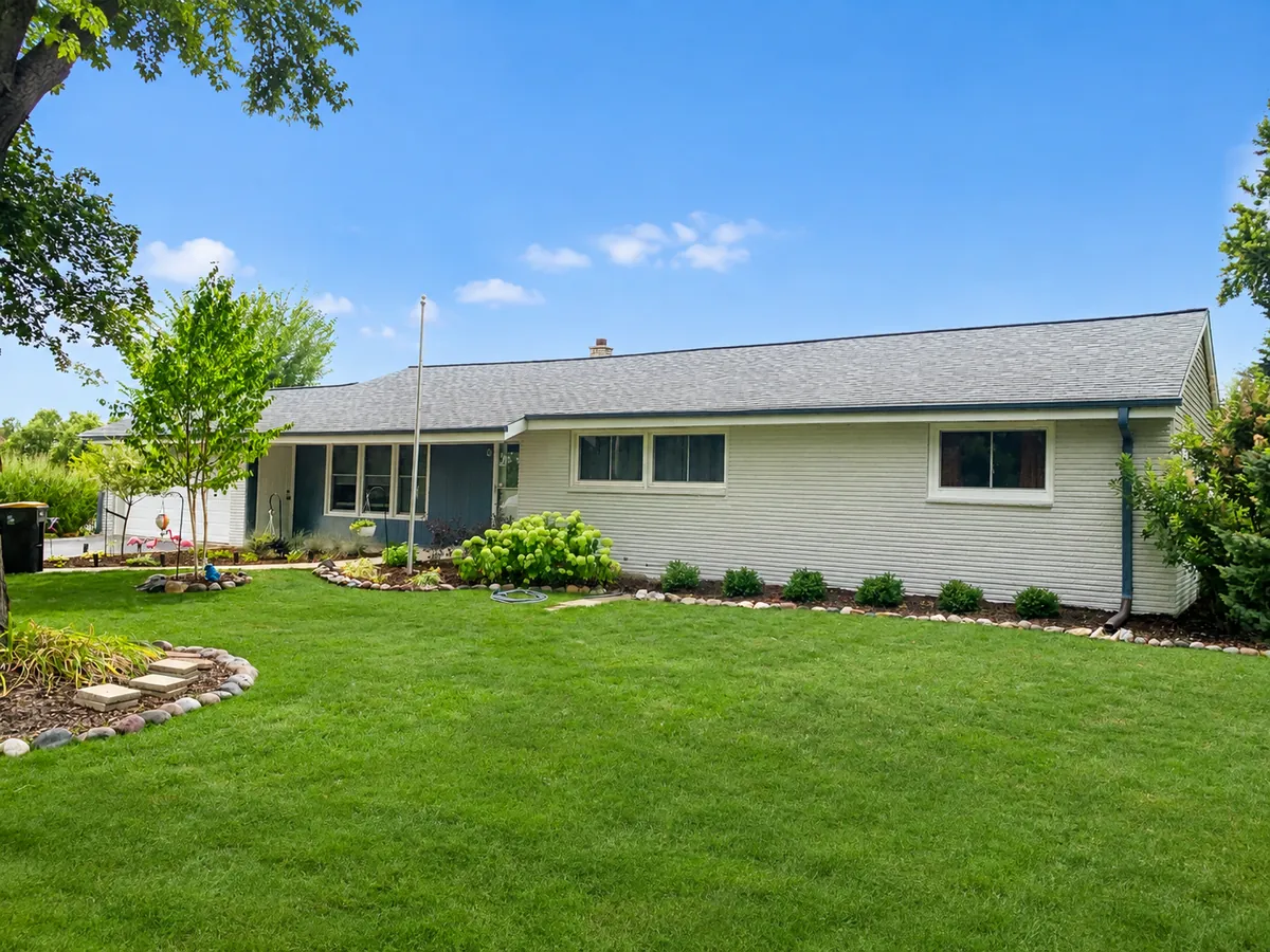Sage green ranch home exterior painting