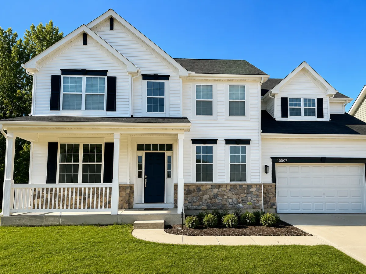 White two-story home exterior with black shutters, freshly painted