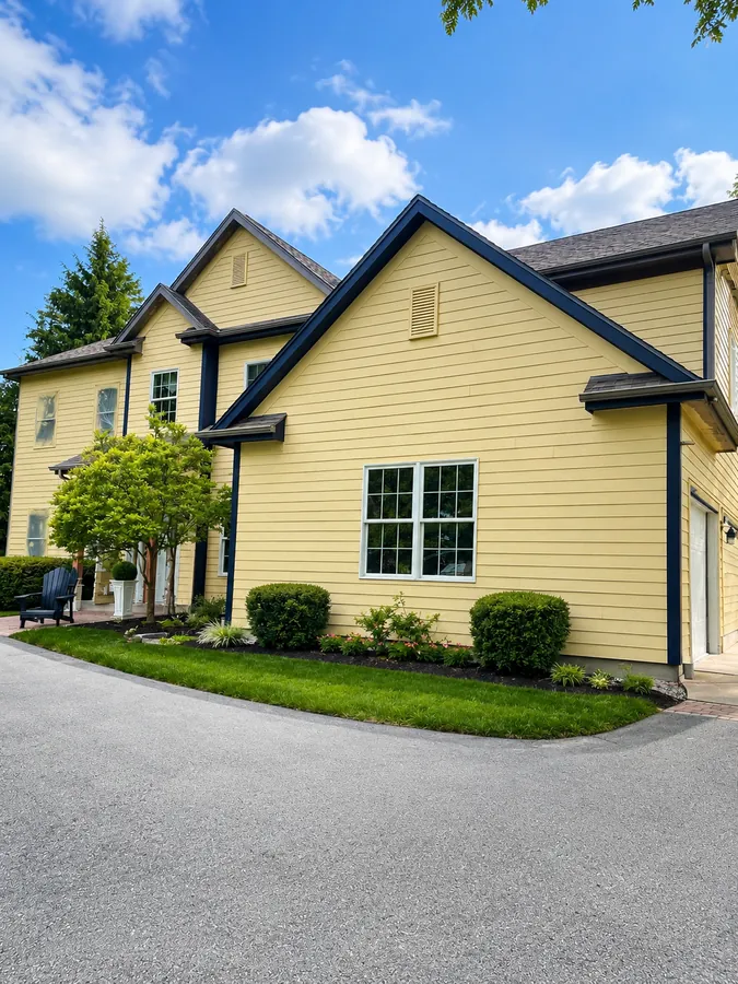 Yellow home exterior with white trim